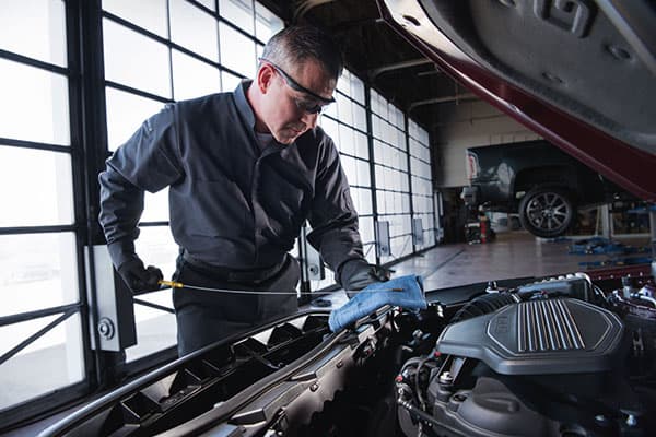 Service technician doing an oil change