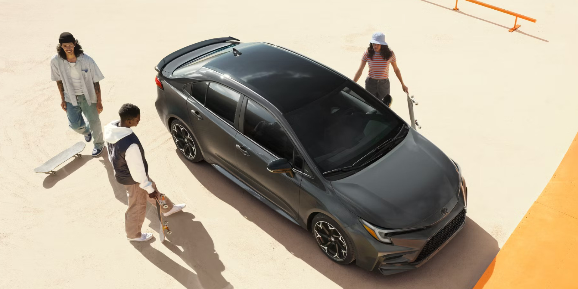 2025 Corolla parked with people around it. 